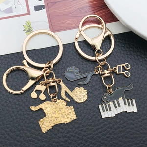 Cute black enamel piano cat keychain set with gold music notes and lobster clasp