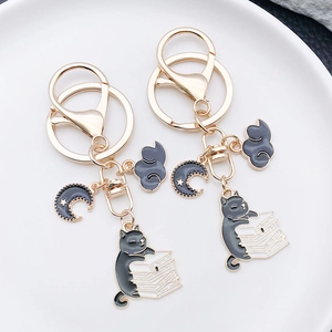 Cartoon black cat reading book zinc alloy keychain with gold lobster clasp and moon charm