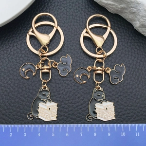 Zinc alloy black cat reading on books keychain with moon and cloud charms for bags