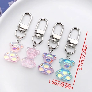 Detailed view of colorful resin gummy bear keychains with size dimensions 5.7cm by 1.5cm