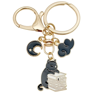 Cute black cat reading on books keychain with gold moon and cloud enamel charms