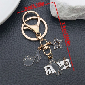 Detailed view of black cat keychain dimensions showing 3cm width and 4.4cm height