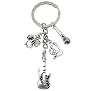 Antique silver music keychain with guitar, drum kit, microphone and treble clef charms