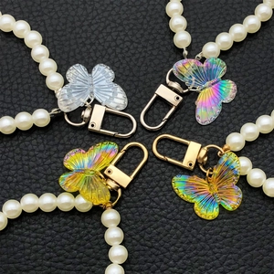 Chic acrylic butterfly and faux pearl phone charm chain with metal lobster clasp