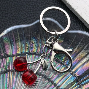 Realistic translucent red resin double cherry keychain with silver metal lobster clasp