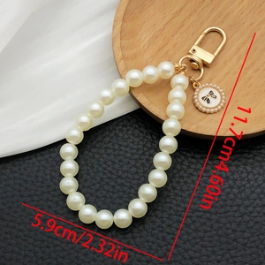 Elegant pearl bead keychain with a bow charm and golden clasp for women accessories