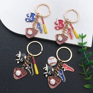 Close-up of baseball themed metal keychains featuring enamel gloves, shoes and hats