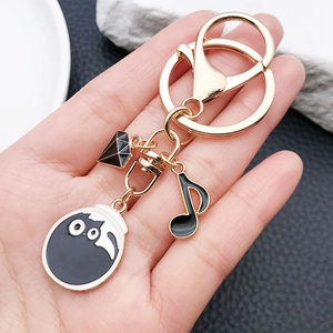 Porte-clés doré avec charm chat de dessin animé, pendentif diamant et note de musique