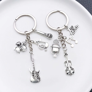 Antique silver music keychain set with guitar, drum kit, and I Love Music pendants