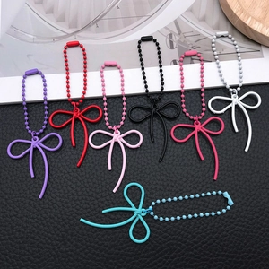 Set of seven colorful alloy bowknot pendants with ball chains for DIY phone cases and bags