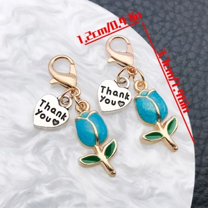 Detail showing tulip heart pendant dimensions 1.2cm x 3.7cm with golden lobster clasp