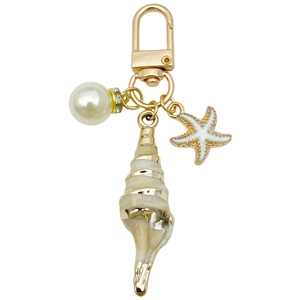 Minimalist gold keychain with ocean charms including white pearl, starfish, and conch shell