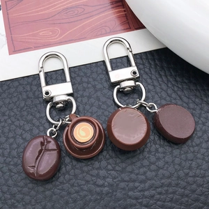 Resin coffee bean latte art keychain with silver carabiner for creative backpack decor