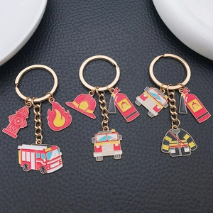 Creative firefighter keychain set with fire truck extinguisher and helmet charms
