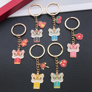 Traditional Chinese lion dance keychains in six vibrant colors with blessing tags