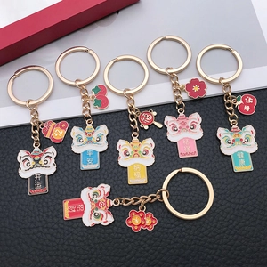 Set of six colorful guardian lion keychains with Chinese blessing charms and gold metal finish