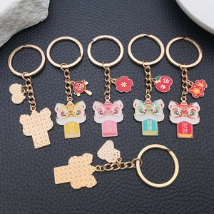 Detailed view of enamel lion dance keychains with gold plating and lucky charms