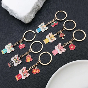 Detailed macro view of six colorful Chinese guardian lion keychains with lucky charms