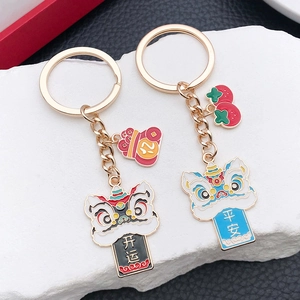 Detailed macro view of Chinese guardian lion keychains with lucky charms and charms
