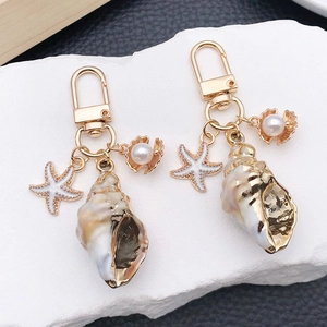 Porte-clés Thème Océan avec Conque Étoile de Mer et Künstliche Perle Bijou de Sac en Acrylique Or Métal Style Plage Pendentif Femme