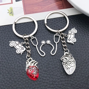 Detailed view of medical keychain with stethoscope, ambulance, and red heart charms