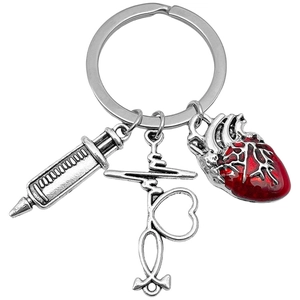 Antique silver medical keychain with syringe, stethoscope heart and red heart charms