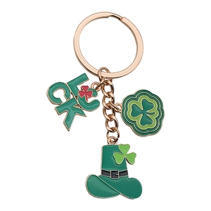 Green St. Patrick's Day luck clover hat keychain with gold tone metal charms