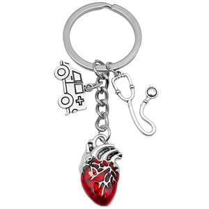 Antique silver medical keychain featuring stethoscope, ambulance, and red heart charms