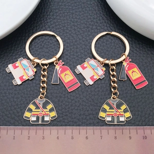 Creative firefighter keychain with red fire truck, extinguisher and uniform pendants