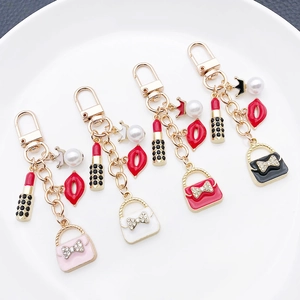 Elegant crown and lipstick keychain set with pearls and handbag charms for women