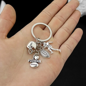 Detail of silver metal American football keychain with helmet and I love football tag