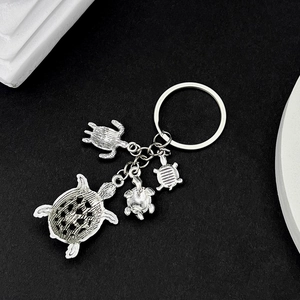 Antique silver sea turtle keychain with four detailed alloy metal turtle charms
