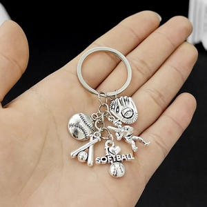 Detail of silver softball keychain featuring glove, bat and I Heart Softball pendant