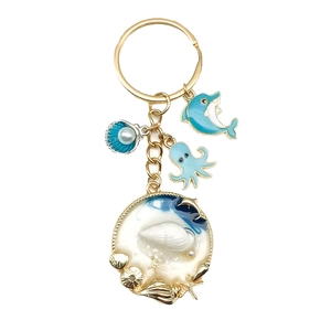 Portachiavi marino dorato con ciondoli delfino blu polpo e perle di conchiglia