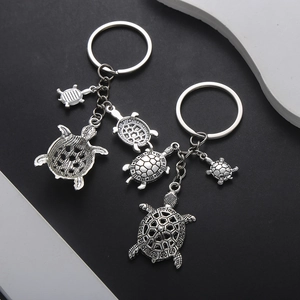 Vintage silver turtle keychain set with detailed antique sea turtle animal pendants