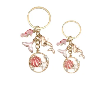 Pink ocean theme shell and seahorse enamel keychain with pearls and gold accents