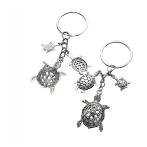 Detailed front and back view of turtle alloy keychain with antique silver plating texture