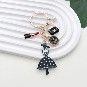 Fashion pearl handbag and elegant black dress silhouette metal keychain with gold plating