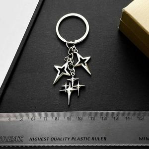 Antique silver four-pointed star alloy keychain with multiple charms for bags and keys