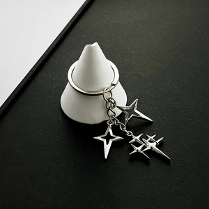 Minimalist silver alloy star keychain with hollow four-pointed pendants for bags