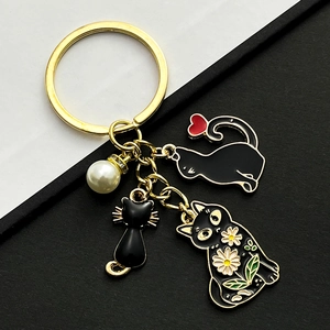 Porte-clés Chat Noir en Émail Dessin Animé pour Femmes Anneau en Métal Doré Avec Motif Cœur Marguerite Et Breloque Künstliche Perle Pendentif De Sac Bijoux Cadeau