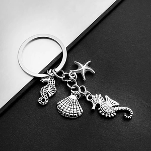 Vintage silver ocean animal keychain with seahorse, starfish, and scallop pendants