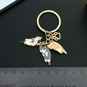 Cute three cats enamel keychain with calico, grey, and orange kittens on gold metal