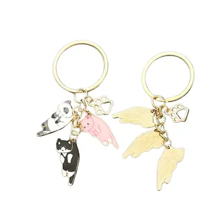 Cartoon kitten keychains showing front and back views with cat paw charm