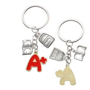 Porte-clés sac à dos d'école avec breloque A+ rouge et pendentif livre sur anneau argent