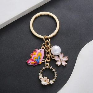 Squisito Portachiavi in Lega Con Farfalla Rosa Fiore e Perla Artificial Oro Strass Ciondolo Ciliegio Ciondolo per Borsa Regalo Donna