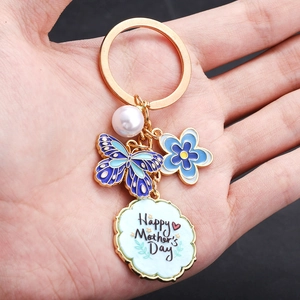 Portachiavi dorato Happy Mother's Day con farfalla blu, fiore e perla raffinata