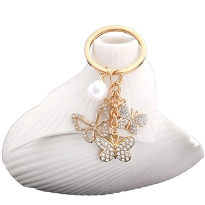 Eleganter goldener Schmetterling Schlüsselanhänger mit Kristallen und Perle