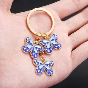 Cartoon DIY blue enamel butterfly keychain with gold plating and gradient wing details