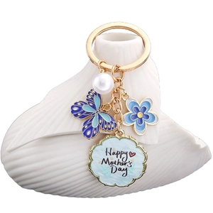 Portachiavi con farfalla blu fiore e perla con ciondolo dorato Happy Mother's Day